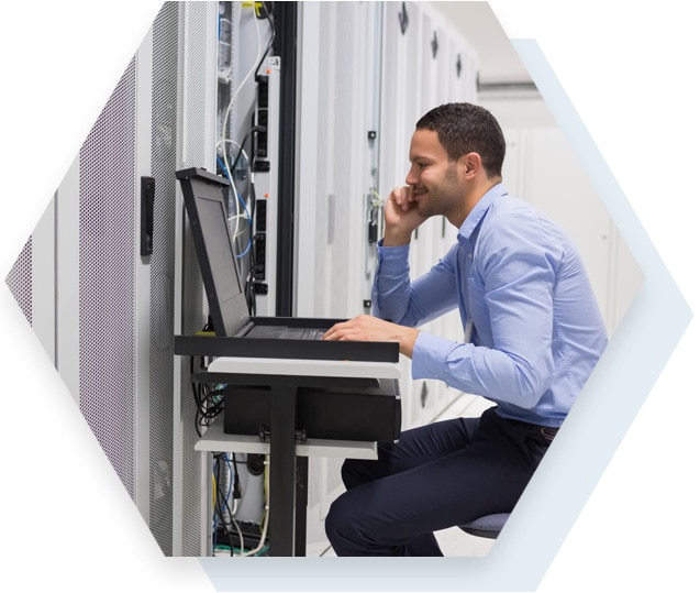 Network Engineer Working on Computer Man Working in Computer Server Room